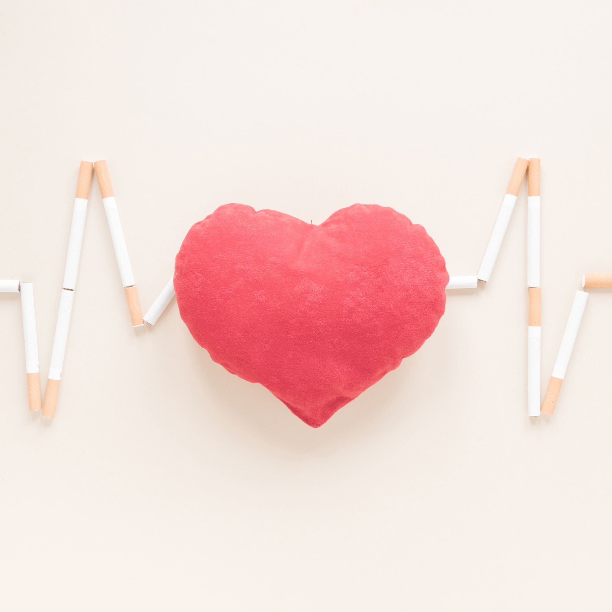 top-view-heart-surrounded-by-cigarettes_23-2148160891.jpg