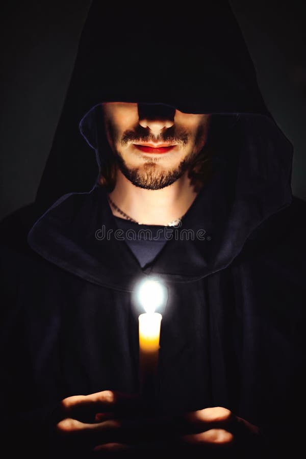 monk-dark-over-candle-idly-monk-candle-112579111.jpg